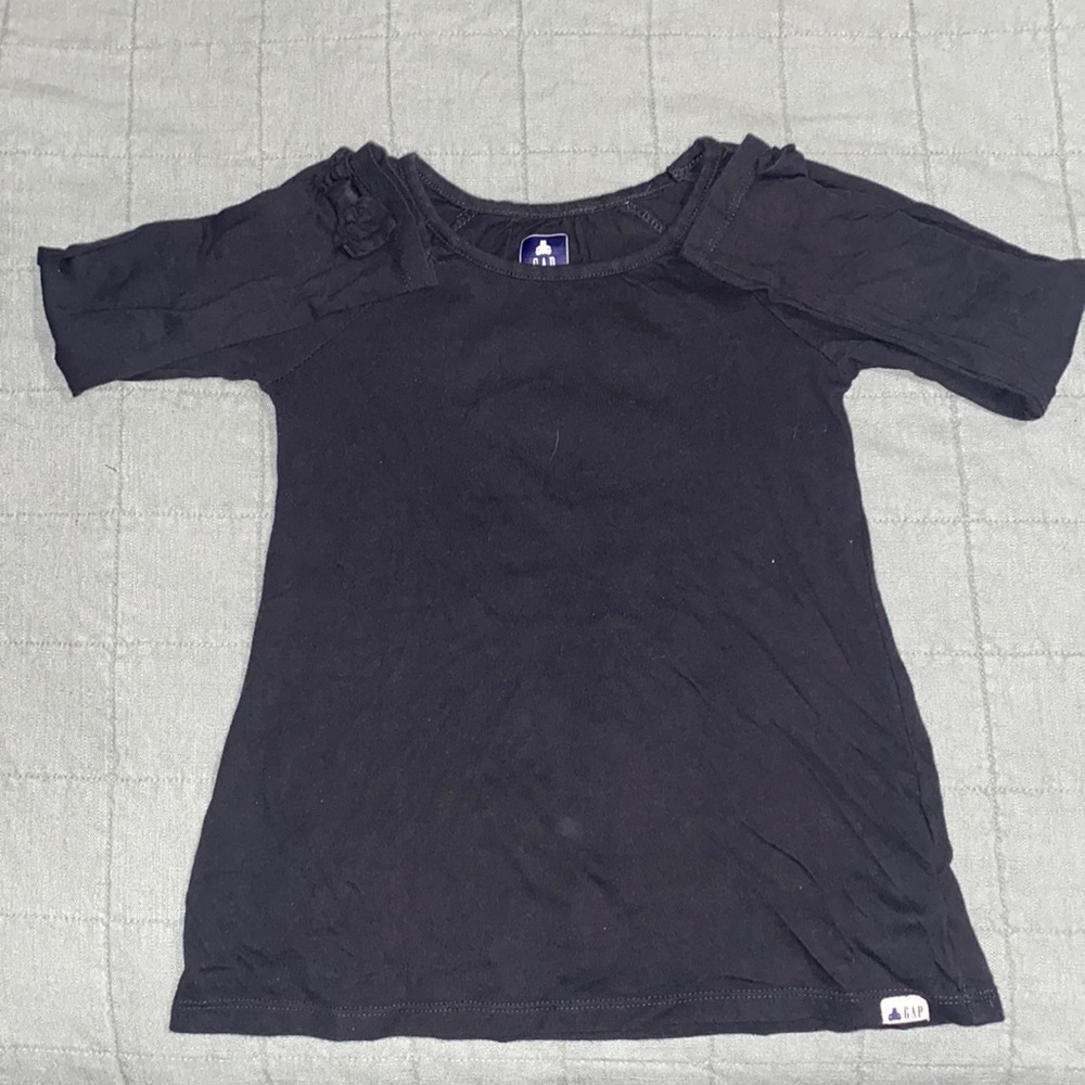 Shirt 1; black long sleeve Size 5 toddlers. Shirt 2; H&M Long sleeve size 6x/7